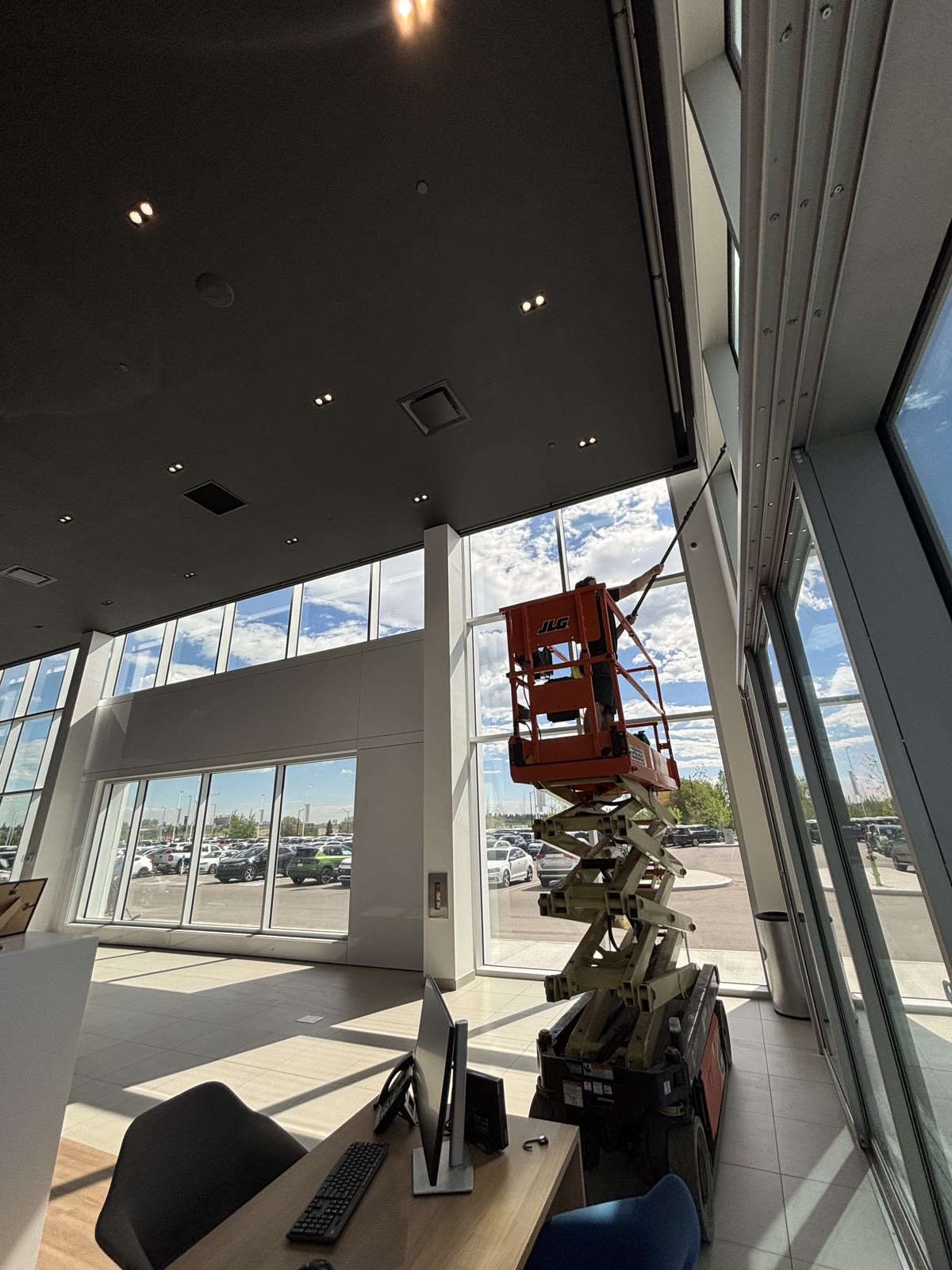 SudBuds cleaning commercial windows on a Calgary property